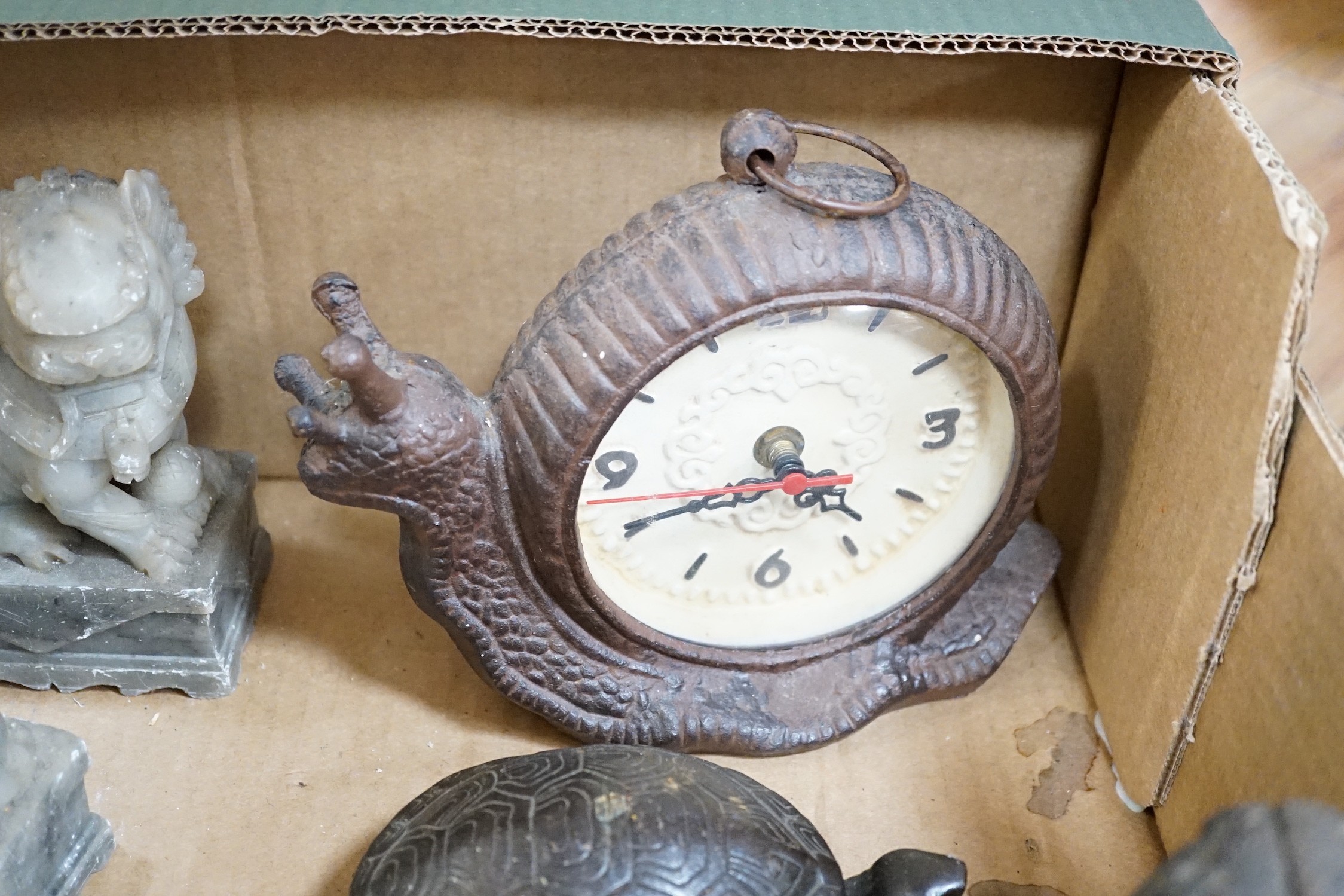 A metal figural money box, a pair of hardstone temple dogs, a novelty snail clock, metal tools and a United Artists 1930 illustrated magazine